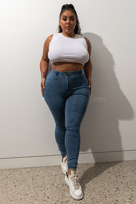 Super comfortable, stretchy and curve accentuating designed to sculpt your bum. High waistband that gives you a waist cinching affect, moulding it in all the right places. Looks like a traditional straight leg denim pant but in the worlds most comfortable Denim fabric